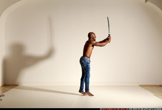 Man Adult Athletic Black Fighting with sword Moving poses Pants