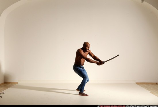 Man Adult Athletic Black Fighting with sword Moving poses Pants