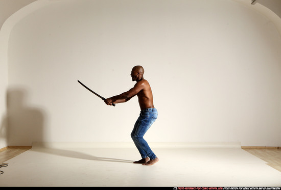 Man Adult Athletic Black Fighting with sword Moving poses Pants