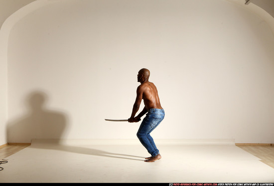 Man Adult Athletic Black Fighting with sword Moving poses Pants