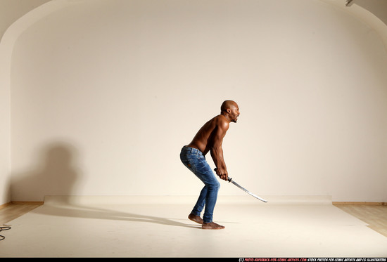 Man Adult Athletic Black Fighting with sword Moving poses Pants