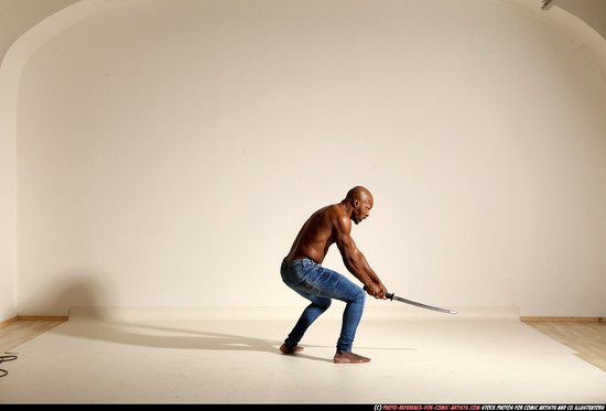 Man Adult Athletic Black Fighting with sword Moving poses Pants