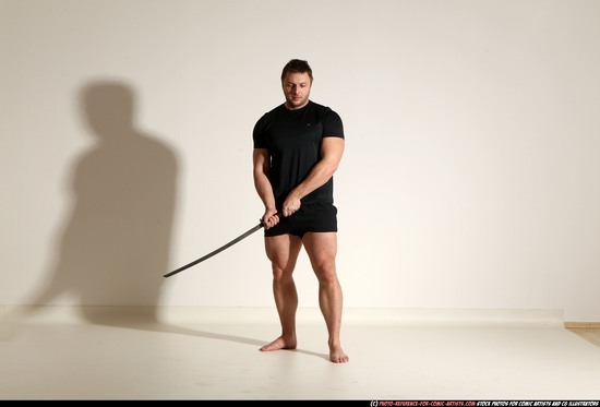 Man Adult Muscular White Fighting with sword Kneeling poses Sportswear