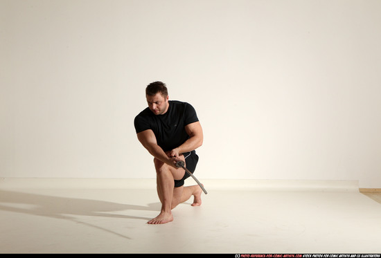 Man Adult Muscular White Fighting with sword Kneeling poses Sportswear