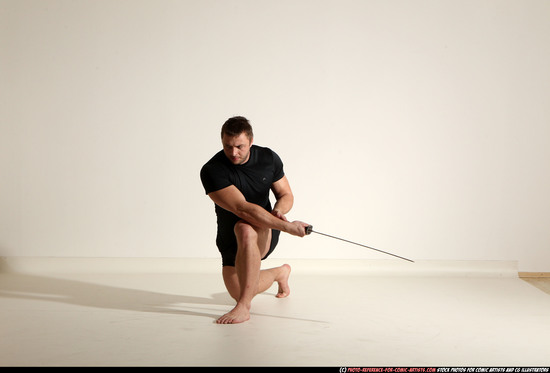 Man Adult Muscular White Fighting with sword Kneeling poses Sportswear