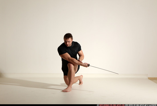 Man Adult Muscular White Fighting with sword Kneeling poses Sportswear