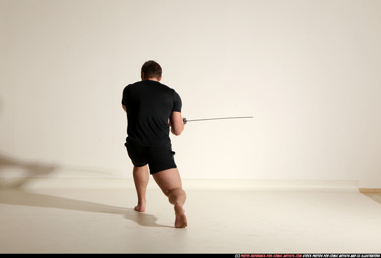 Man Adult Muscular White Fighting with sword Kneeling poses Sportswear