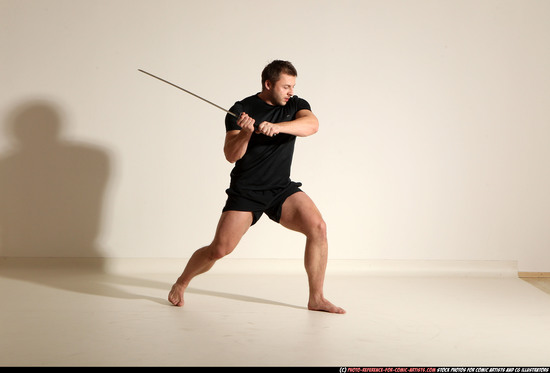 Man Adult Muscular White Fighting with sword Kneeling poses Sportswear