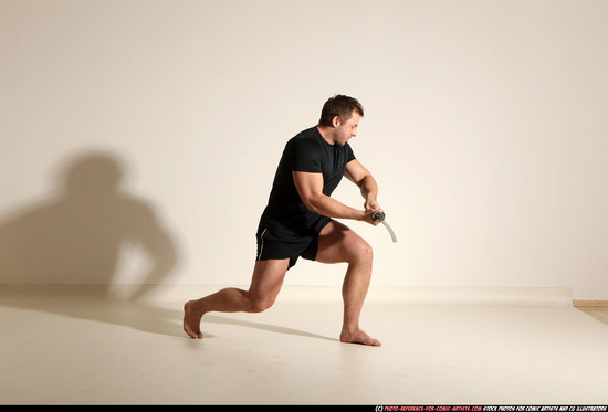 Man Adult Muscular White Fighting with sword Kneeling poses Sportswear