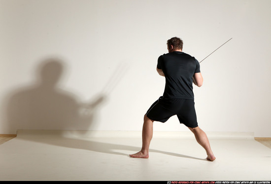 Man Adult Muscular White Fighting with sword Kneeling poses Sportswear