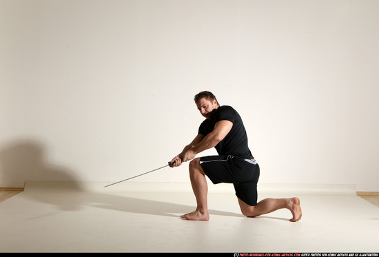 Man Adult Muscular White Fighting with sword Kneeling poses Sportswear