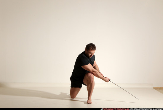 Man Adult Muscular White Fighting with sword Kneeling poses Sportswear