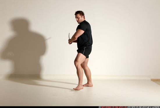 Man Adult Muscular White Fighting with sword Kneeling poses Sportswear