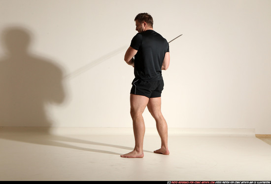 Man Adult Muscular White Fighting with sword Kneeling poses Sportswear