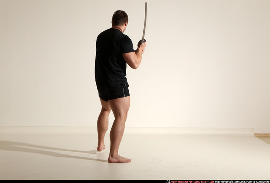 Man Adult Muscular White Fighting with sword Kneeling poses Sportswear