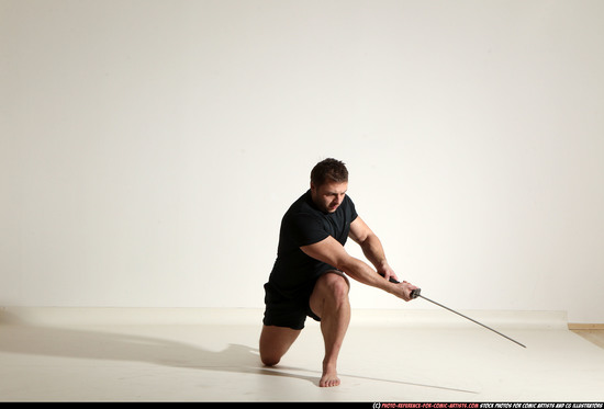 Man Adult Muscular White Fighting with sword Kneeling poses Sportswear