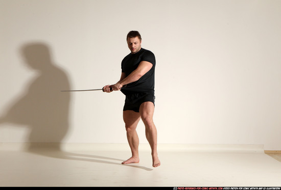 Man Adult Muscular White Fighting with sword Kneeling poses Sportswear