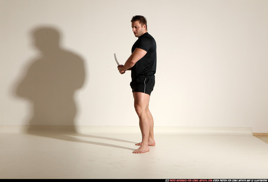 Man Adult Muscular White Fighting with sword Kneeling poses Sportswear