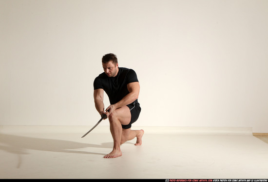 Man Adult Muscular White Fighting with sword Kneeling poses Sportswear