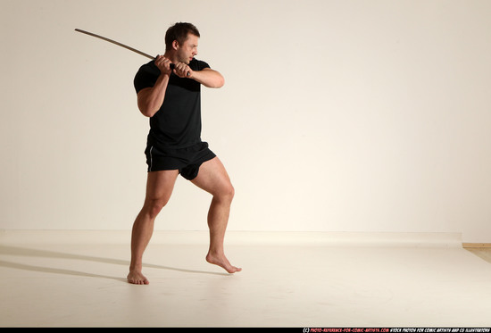 Man Adult Muscular White Fighting with sword Kneeling poses Sportswear