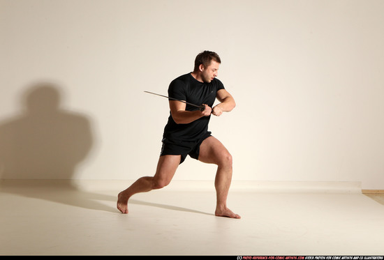 Man Adult Muscular White Fighting with sword Kneeling poses Sportswear