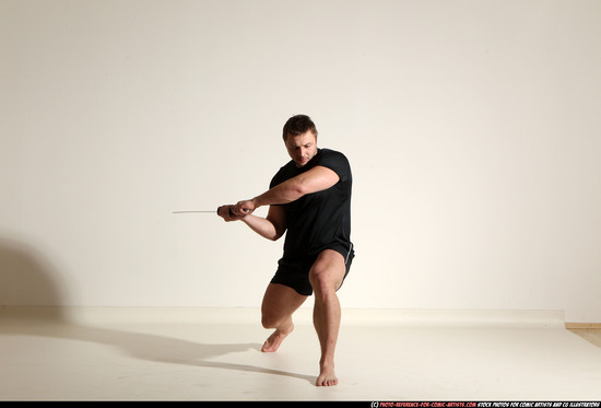 Man Adult Muscular White Fighting with sword Kneeling poses Sportswear