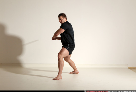 Man Adult Muscular White Fighting with sword Kneeling poses Sportswear