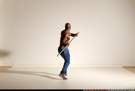 Man Adult Athletic Black Fighting with spear Moving poses Pants