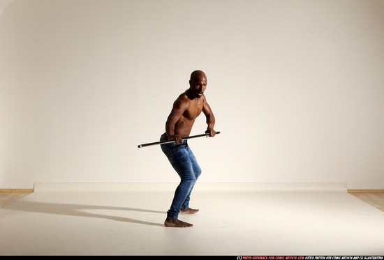 Man Adult Athletic Black Fighting with spear Moving poses Pants