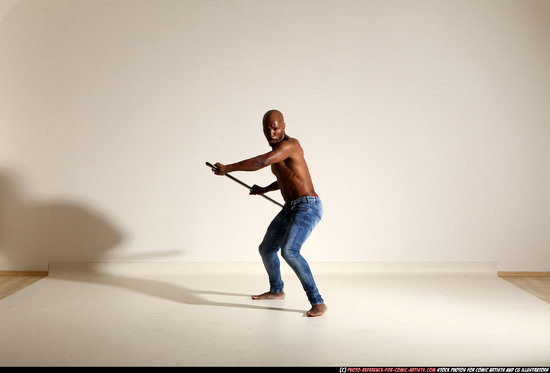 Man Adult Athletic Black Fighting with spear Moving poses Pants