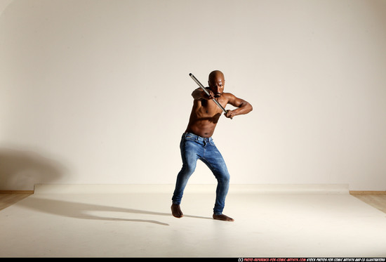 Man Adult Athletic Black Fighting with spear Moving poses Pants