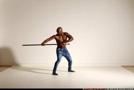 Man Adult Athletic Black Fighting with spear Moving poses Pants