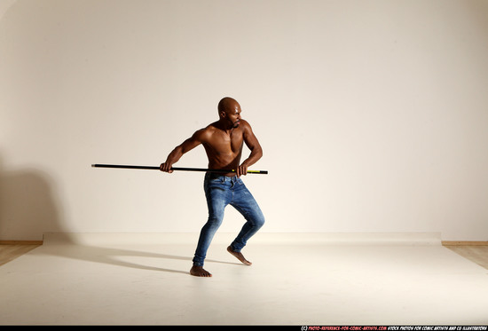 Man Adult Athletic Black Fighting with spear Moving poses Pants