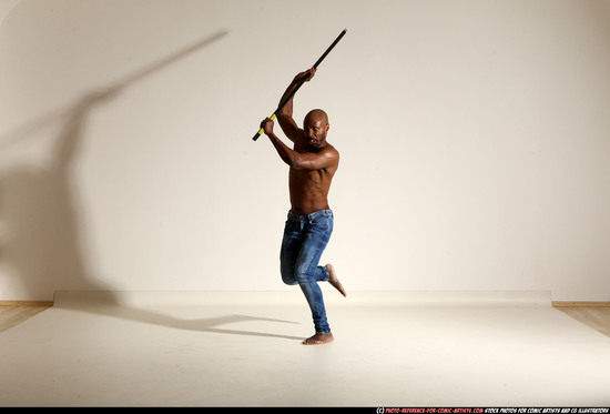 Man Adult Athletic Black Fighting with spear Moving poses Pants