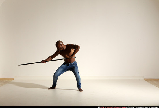 Man Adult Athletic Black Fighting with spear Moving poses Pants