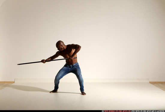 Man Adult Athletic Black Fighting with spear Moving poses Pants