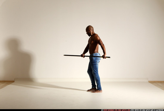 Man Adult Athletic Black Fighting with spear Moving poses Pants