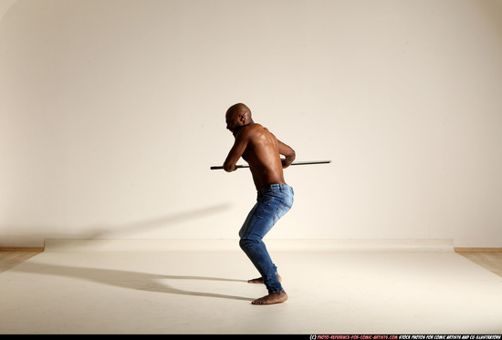 Man Adult Athletic Black Fighting with spear Moving poses Pants