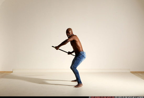 Man Adult Athletic Black Fighting with spear Moving poses Pants