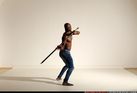 Man Adult Athletic Black Fighting with spear Moving poses Pants