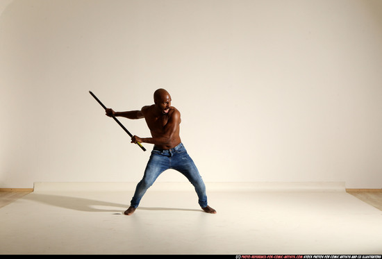 Man Adult Athletic Black Fighting with spear Moving poses Pants