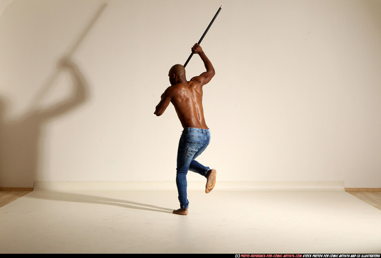 Man Adult Athletic Black Fighting with spear Moving poses Pants