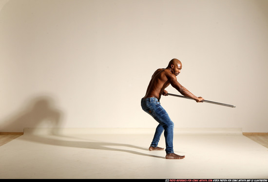 Man Adult Athletic Black Fighting with spear Moving poses Pants