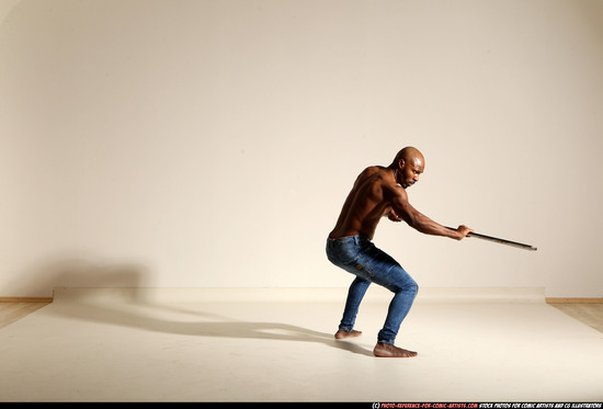 Man Adult Athletic Black Fighting with spear Moving poses Pants