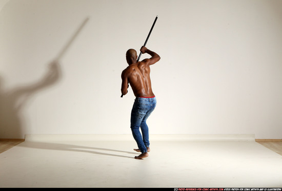 Man Adult Athletic Black Fighting with spear Moving poses Pants