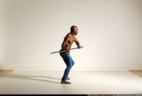 Man Adult Athletic Black Fighting with spear Moving poses Pants