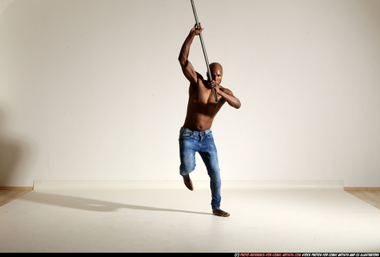 Man Adult Athletic Black Fighting with spear Moving poses Pants