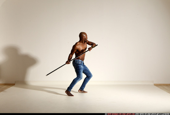 Man Adult Athletic Black Fighting with spear Moving poses Pants