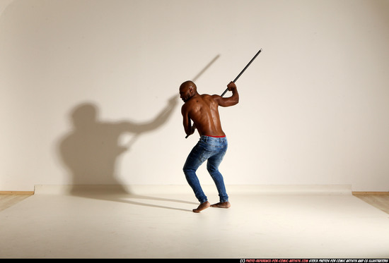 Man Adult Athletic Black Fighting with spear Moving poses Pants