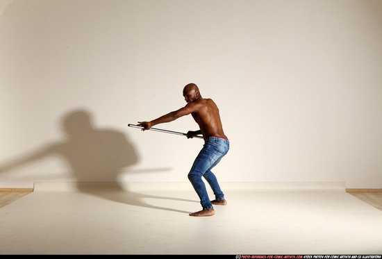 Man Adult Athletic Black Fighting with spear Moving poses Pants